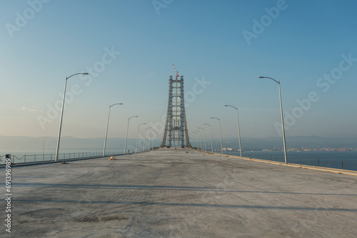 Osman Gazi Bridge (Izmit Bay Bridge). Izmit, Kocaeli, Turkey. Construction of a new road bridge continues across the Marmara Sea. photo