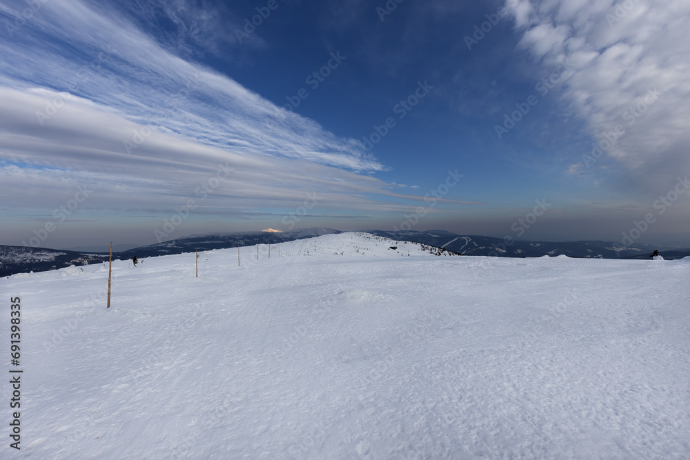 View of winter mountain landscape with beautiful sky View of winter mountain landscape with beautiful sky