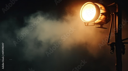  light flash coming from a flashlight on the dark, the spotlight on a stage with smoke coming out in teather, concer, during a music festival. Light comes from a stage with a band show