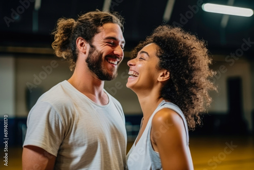 Adult male and female hip-hop couples dancing at practice, smiling being happy. Youth culture, movement, style and fashion, action, breakdance.