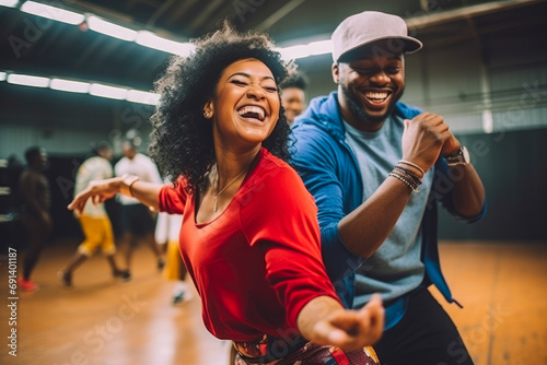 Adult male and female hip-hop couples dancing at practice, smiling being happy. Youth culture, movement, style and fashion, action, breakdance. photo