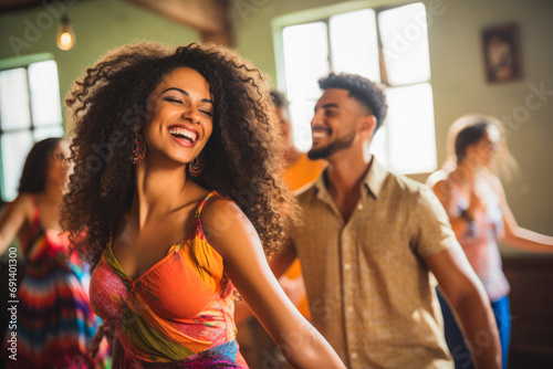 Afro american and caucasian dancers dancing in the dancing school  smiling. Relaxed atmosphere  couples teaching how to dance with instructor.