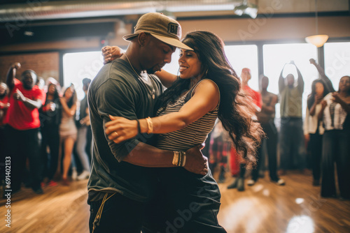 Group of hip-hop dancers performing, practicing in a studio. Youth culture, movement, style and fashion, action, breakdance.