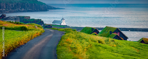 Wallpaper Mural Panoramic summer view of Kirkjubour village with turf-top houses, Faroe Islands,  Denmark, Europe. Wonderful morning scene of Hestur Island. Traveling concept background. Torontodigital.ca
