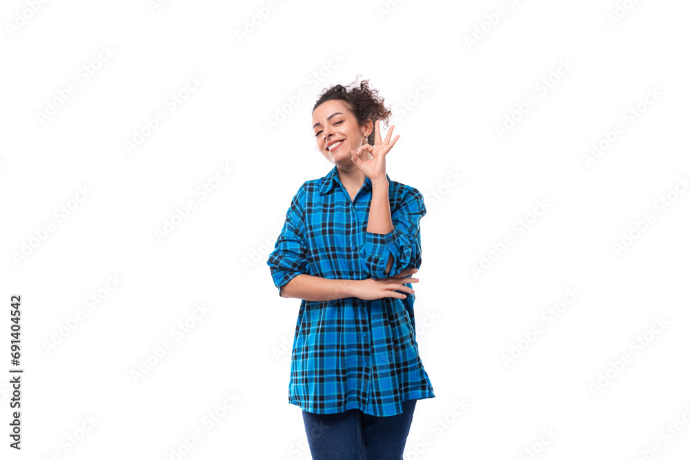 european friendly young lady with curly ponytail hairstyle dressed in a blue shirt with a plaid pattern european friendly young lady with curly ponytail hairstyle dressed in a blue shirt with a plaid pattern