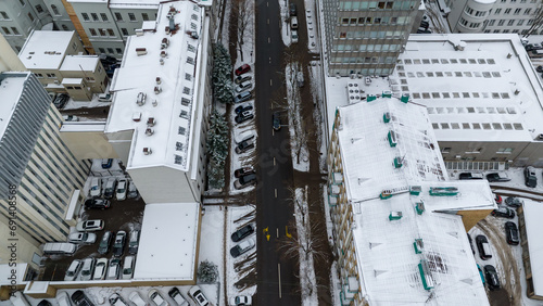 Drone photography of city street and surrounding buildings in snow © M