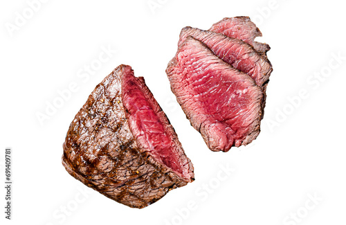 Grilled Rump sirloin steak sliced on a tray with herbs.  Transparent background. Isolated photo