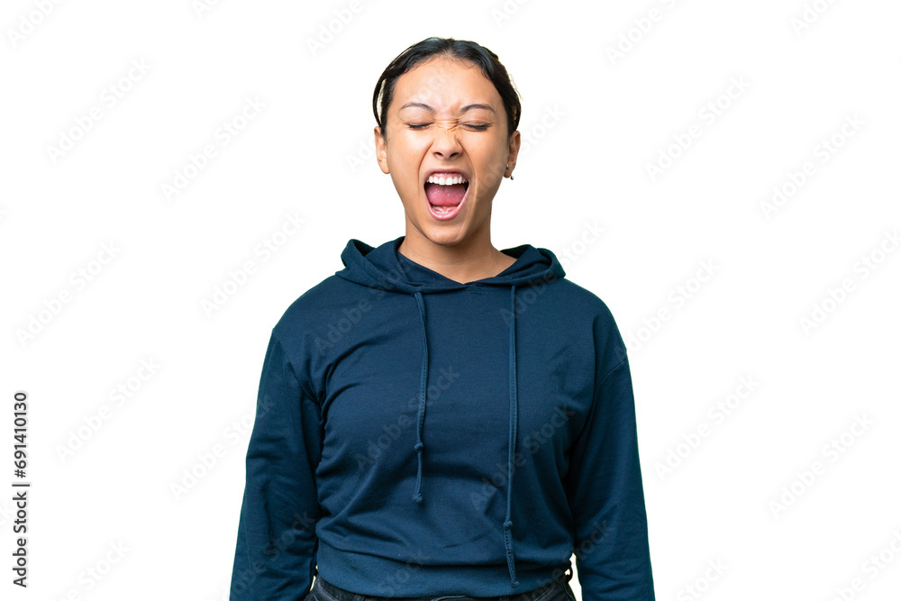 Young Uruguayan woman over isolated chroma key background shouting to the front with mouth wide open Young Uruguayan woman over isolated chroma key background shouting to the front with mouth wide open