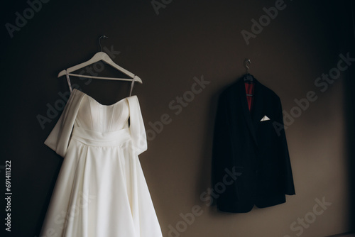 bride's dress and groom's suit at the hotel