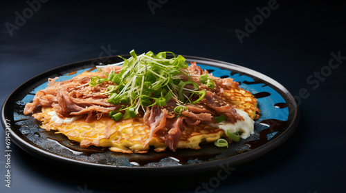 Okonomiyaki on blue table.