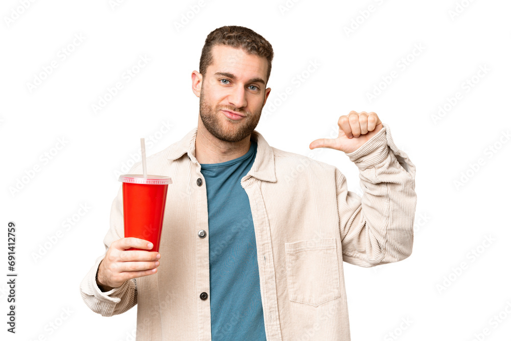 Young handsome blonde man holding soda over isolated chroma key background proud and self-satisfied Young handsome blonde man holding soda over isolated chroma key background proud and self-satisfied