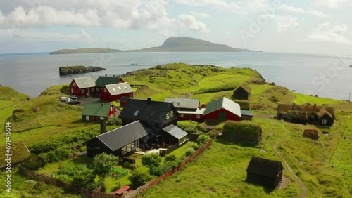 4k drone flight moving to the side footage (Ultra High Definition) of typical turf-top houses. Summer scene of outskirts of Torshavn city, capital of Faroe Islands, Denmark, Europe.