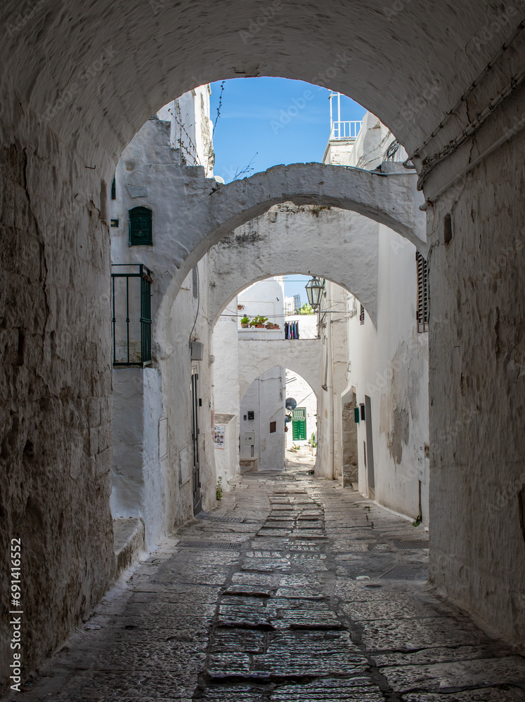 Naklejka premium Ostuni, Italy - one of the most beautiful villages in South Italy, Ostuni displays a wonderful Old Town with narrow streets and alleys 
