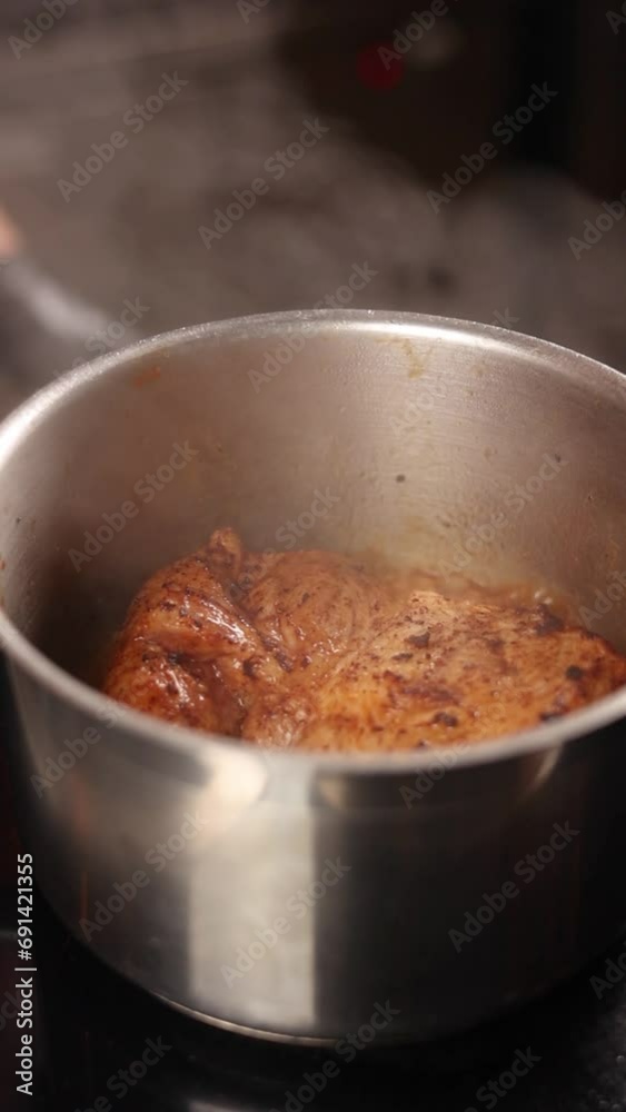 Pork with spices stewed in a saucepan