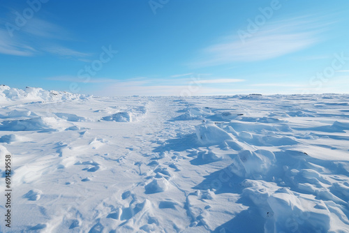 Vast frozen tundra at midday. Empty clear horizon. Plain after a snowstorm. Winter landscape