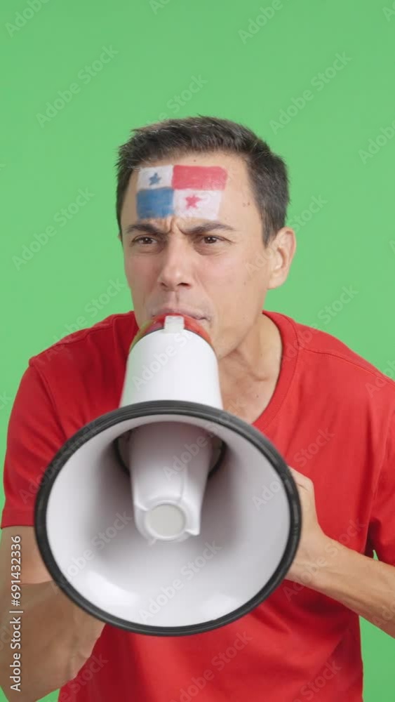 Excited man with panamanian flag on face using a megaphone Excited man with panamanian flag on face using a megaphone