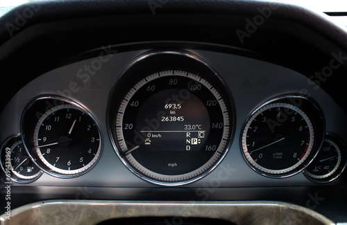 Close up Digital Car dashboard. A close-up of the analog speedometer and tachometer modern car.