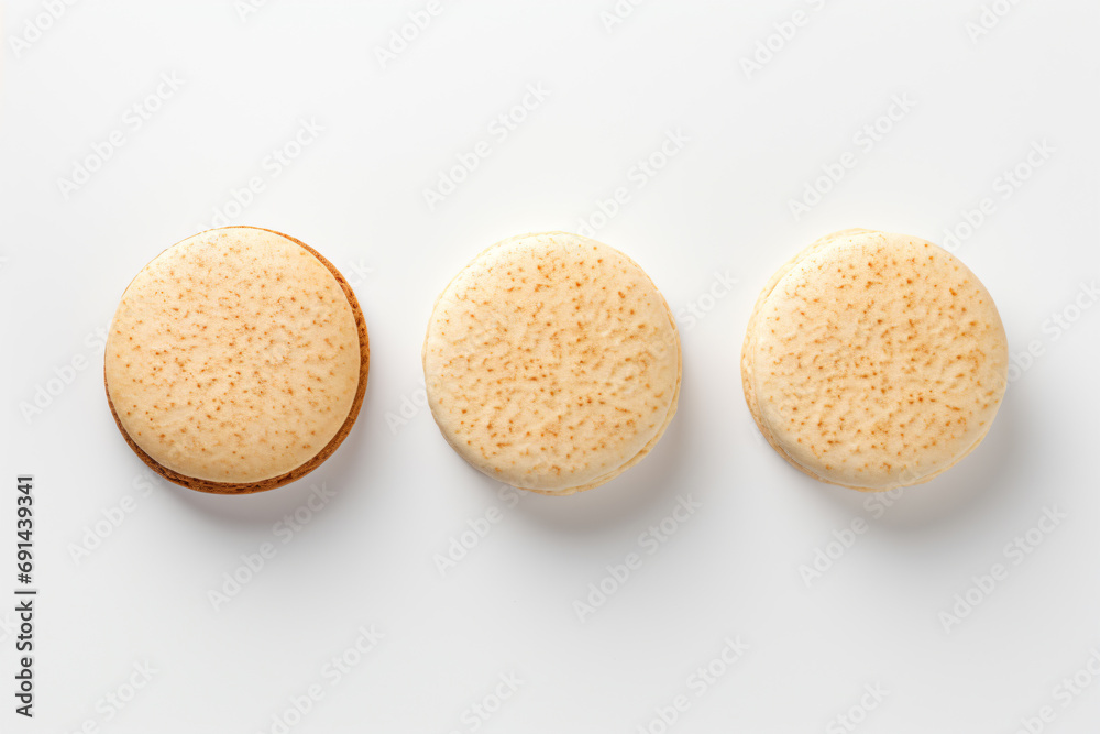 three cookies are arranged on a white surface three cookies are arranged on a white surface