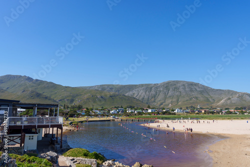 The beautiful Kleinmond Lagoon and Estuary at the Blue Flag Kleinmond beach with views of the Palmiet Mountains. Overberg. Western Cape, South Africa photo