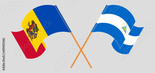 Crossed and waving flags of Moldova and Nicaragua photo