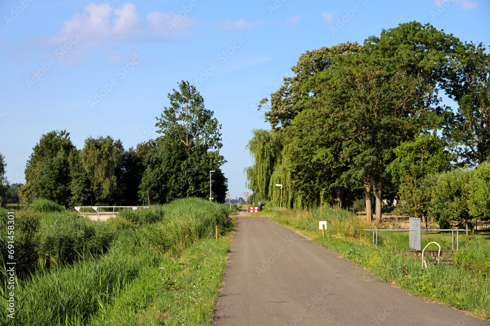 Pastures with farms and roads in the future Fifth Village of the Zuidplaspolder of the municipality of Zuidplas