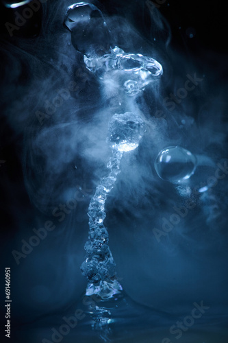The process of boiling water, a stream of water shooting out of a humidifier or diffuser taken in close-up