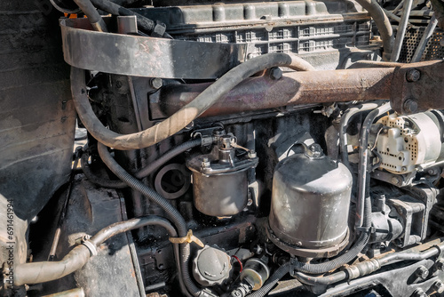 Old tractor engine close-up. Worn out engine in full frame. Background.