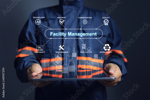 Facility management concept with engineer using tablet to show performance of technology applied on facility in the smart city such as security, maintenance, environment, conservation photo