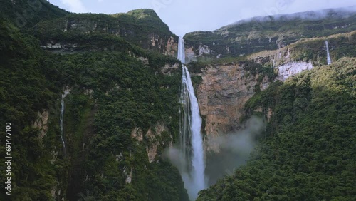 Gocta waterfall in the mountains, aerial drone footage in Peru photo