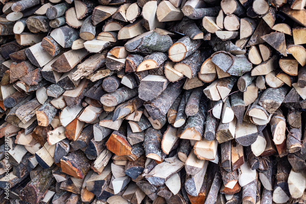 stack of firewood for fireplace at winter time, abstract background close-up. Expensive electricity concept stack of firewood for fireplace at winter time, abstract background close-up. Expensive electricity concept