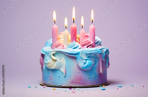 Colorful birthday cake with candles isolated on blue background