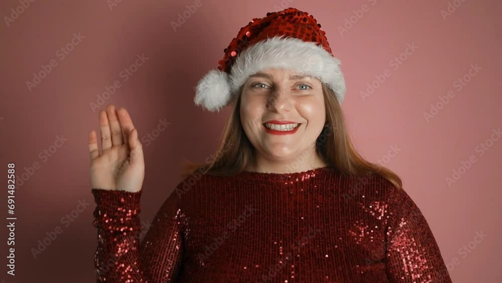 Happy young beautiful Santa hat woman holding video call conversation using cellphone apps, recording streaming online video in social network or reading wishes with 2024 New Year or Christmas. High Happy young beautiful Santa hat woman holding video call conversation using cellphone apps, recording streaming online video in social network or reading wishes with 2024 New Year or Christmas. High