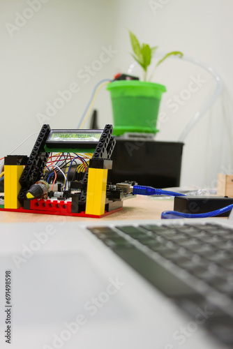 A robotic system with pieces for a plant irrigation system.