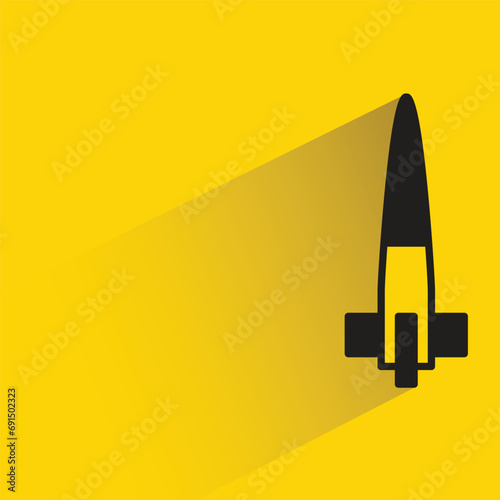 missile icon with shadow on yellow background