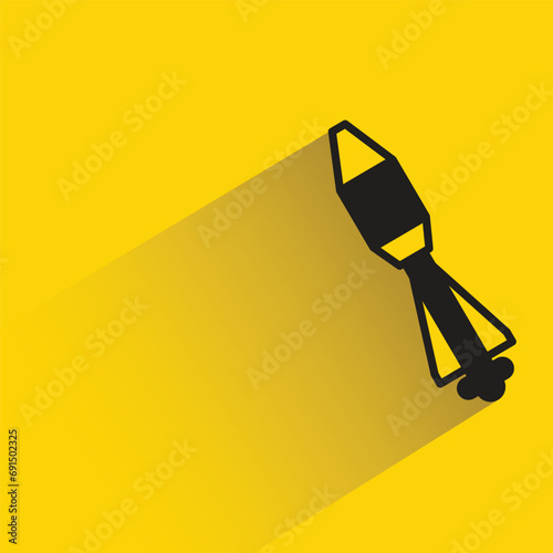 missile icon with shadow on yellow background