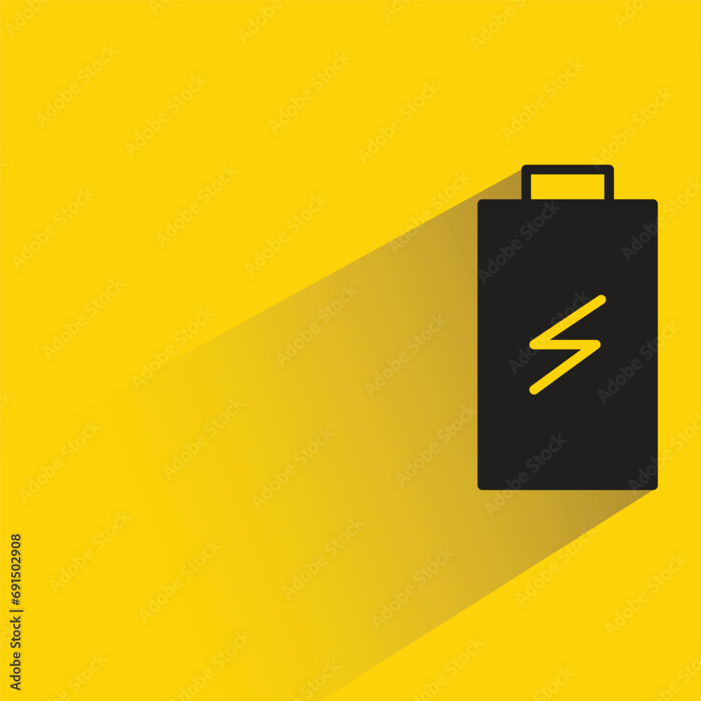 battery with shadow on yellow background