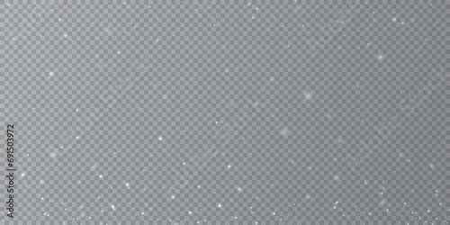 Particles of white magic dust. Shining light particles.Christmas glitter particles. Light effect on a transparent background	
