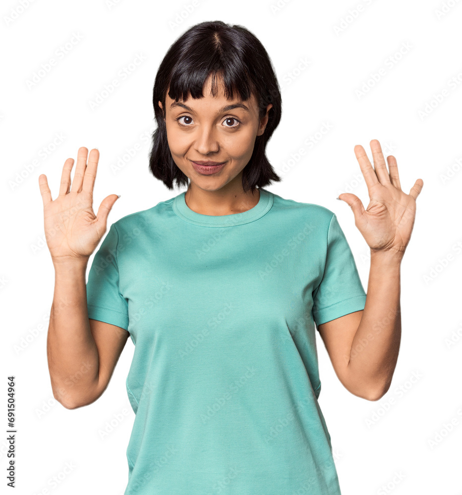Young Hispanic woman with short black hair in studio showing number ten with hands. Young Hispanic woman with short black hair in studio showing number ten with hands.
