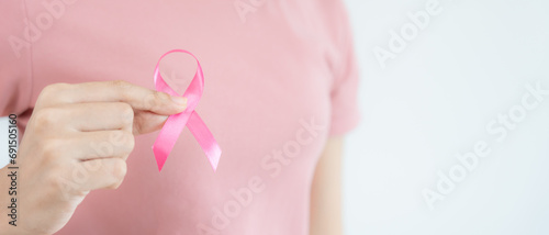 Wallpaper Mural Woman hold pink ribbon breast cancer awareness. Female health check consciousness. international Women Day and World Cancer Day. sign cancer, Symbolic, health care, support patients, timely diagnosis Torontodigital.ca