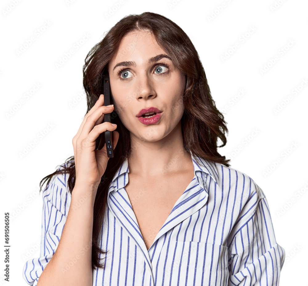 Young Caucasian woman on phone call in studio setting Young Caucasian woman on phone call in studio setting