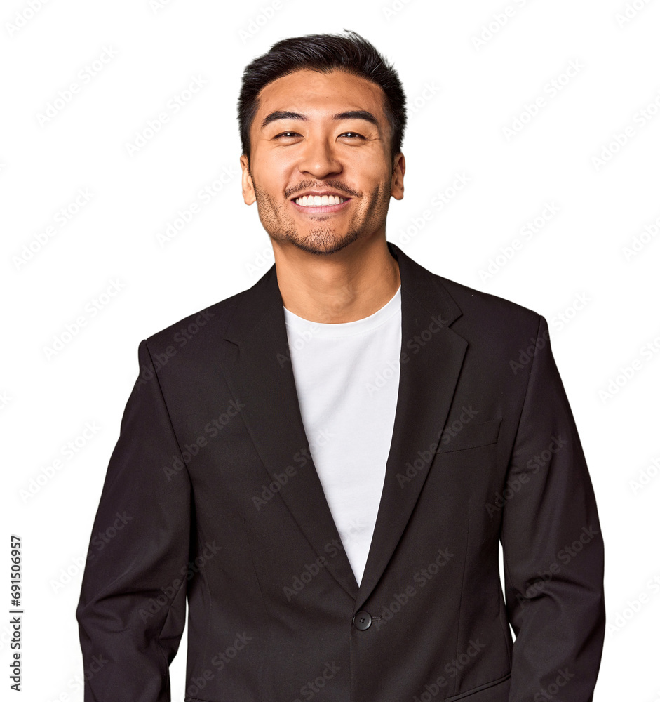 Young Chinese man in business suit in studio happy, smiling and cheerful. Young Chinese man in business suit in studio happy, smiling and cheerful.
