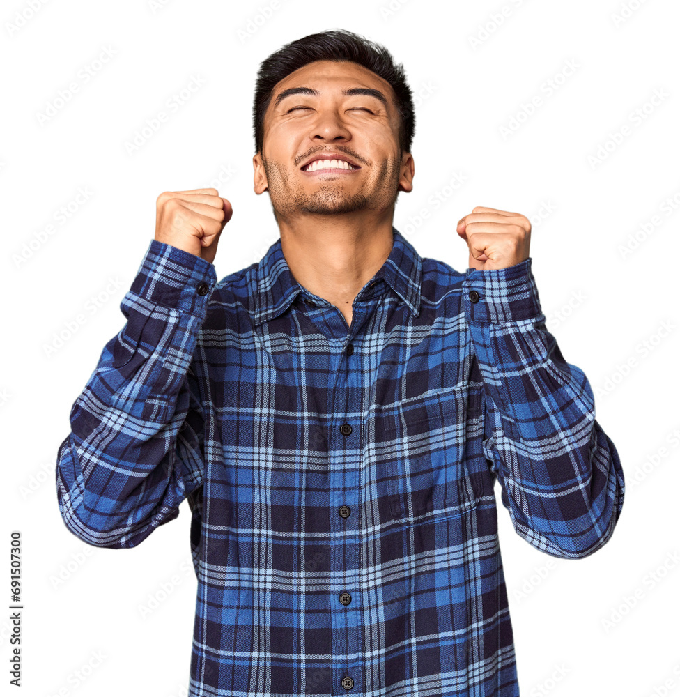 Young Chinese man in studio background celebrating a victory, passion and enthusiasm, happy expression. Young Chinese man in studio background celebrating a victory, passion and enthusiasm, happy expression.