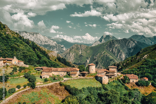 This striking photograph captures the essence of the medieval village of Banduxu, perched atop a mountain pass in the wild landscapes of Asturias, Spain.