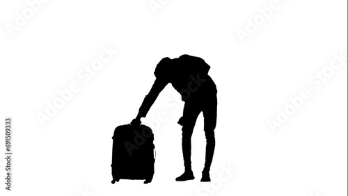 Portrait of traveler isolated on white background alpha channel. Silhouette of man holding suitcase and taking out holder.