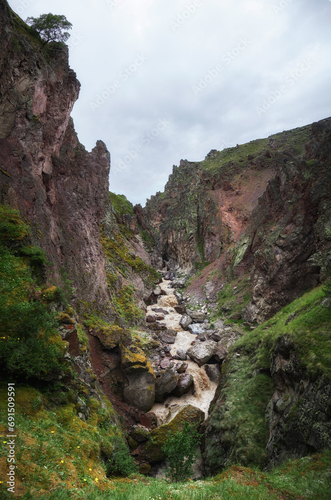 Jily-su tract, Syltran-su mountain waterfall, Elbrus, Caucasus. Thawed mountain waters of the river in summer, a stormy stream