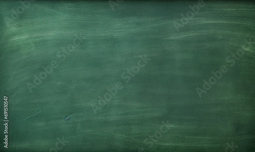 Working place on empty rubbed out on green board chalkboard texture background for learning concept or wallpaper, add text message. 