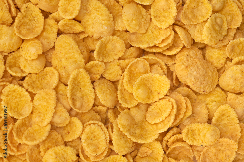 Background and texture of corn flakes. Top view