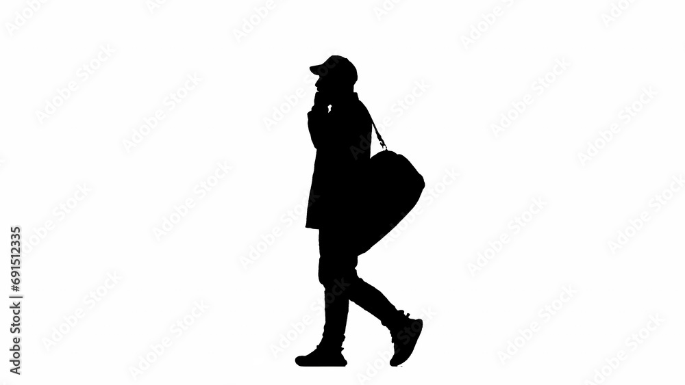 Portrait of traveler isolated on white background alpha channel. Silhouette of man cap walking with sport bag and talking on smartphone.