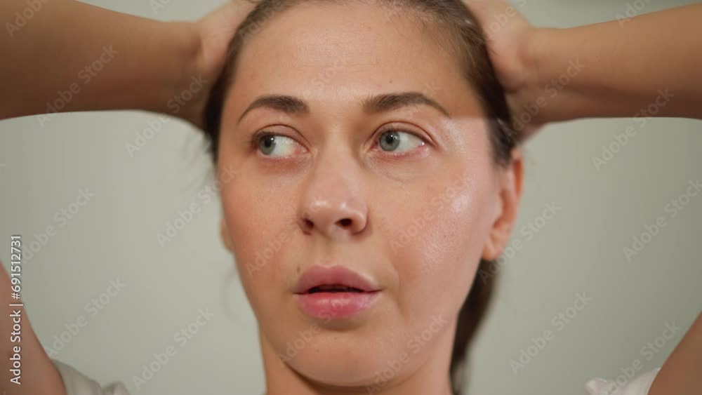 Agitated woman stands in room clutching head closeup. Woman wrestles with distressing emotions seeking way to cope with challenges. Thought about troubles Agitated woman stands in room clutching head closeup. Woman wrestles with distressing emotions seeking way to cope with challenges. Thought about troubles