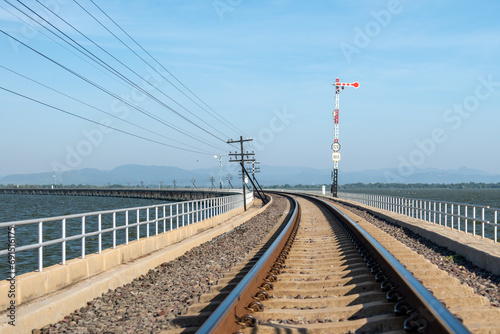 Viewpoint Floating train at Pa Sak Cholasit Dam. For the train crossing the Pasak Cholasit Reservoir to pick up Thai people and tourists visiting Khok Salung on November 25, 2023 in Lopburi Province,  photo